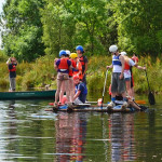 A family camping, enjoying activites.