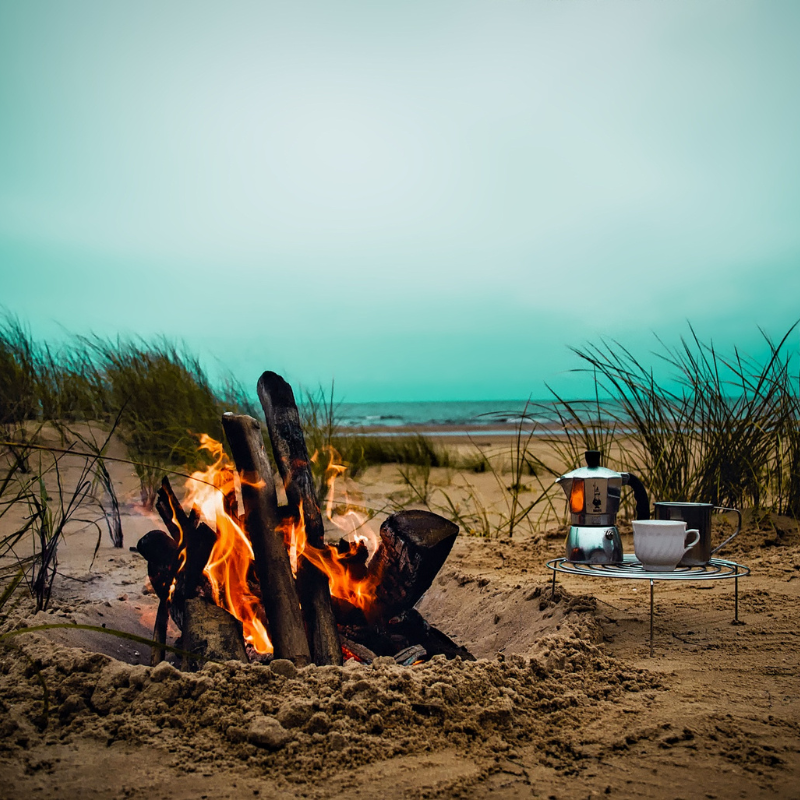 A camping fire on the beach.