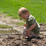 A toddler on a camping trip.