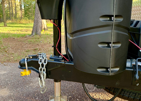 A camping trailer with a hitch lock.