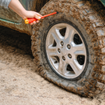 Overlander adjusting tire pressure.